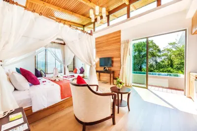 a bedroom in a villa with a view at Wyndham Sea Pearl Resort, Phuket in Patong Beach