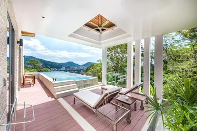 a house with a deck with a pool at Wyndham Sea Pearl Resort, Phuket in Patong Beach