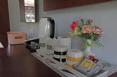 a tray with a vase of flowers on a kitchen counter at Phi Phi Andaman Beach Resort in Phi Phi Don