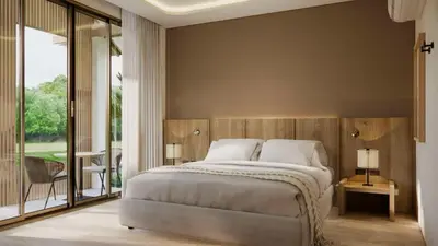 a bedroom with a large bed and a large window at Phi Phi Andaman Legacy Resort in Phi Phi Don
