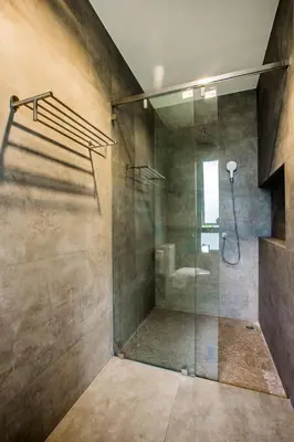 a bathroom with a shower with a glass door at Villa Raeya in Ao Nang Beach