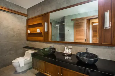 a bathroom with two sinks and a toilet at Villa Palavee (B3) in Ao Nang Beach