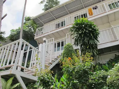an image of a house with a white porch at Uphill Cottage in Phi Phi Don