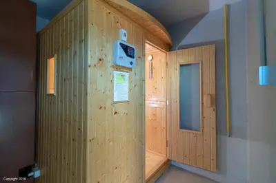 a room with a wooden wall with a door at Modern Living Residence in Patong Beach