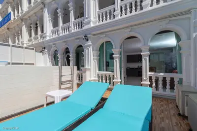 a pair of blue yoga mats on the balcony of a building at Modern Living Residence in Patong Beach