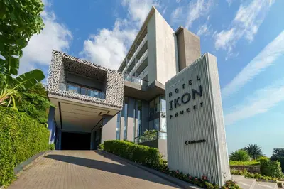 a building with a sign in front of it at Hotel IKON Phuket - SHA Extra Plus in Karon Beach