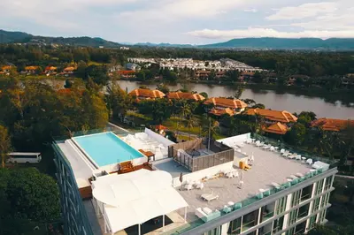 an aerial view of a building with a swimming pool at Oceanstone by Holy Cow, 2-BR, 60 m2, tree view in Bang Tao Beach