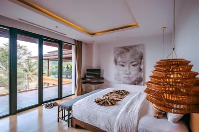 a bedroom with a bed and a large window at VILLA Chacha VILLA Coco RESORT APOLLONIA in Ko Yao Noi