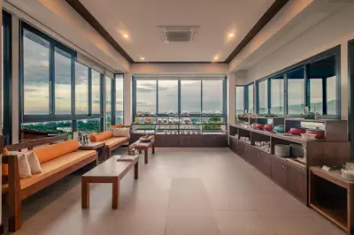 a large room with couches and tables and windows at Andakiri Pool Villa Panoramic Sea View in Ao Nang Beach