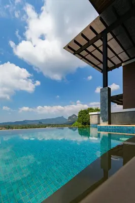 a swimming pool with a view of a body of water at Andakiri Pool Villa Panoramic Sea View in Ao Nang Beach