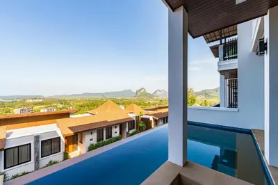 a view from the balcony of a villa with a swimming pool at Andakiri Pool Villa Panoramic Sea View in Ao Nang Beach