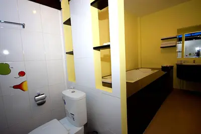 a bathroom with a white toilet and a sink at Supsangdao Resort in Ao Nang Beach
