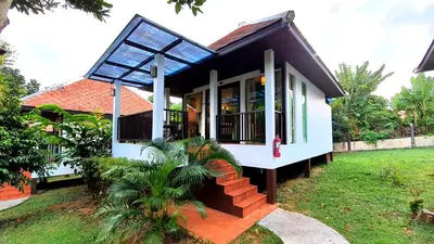 a small house with a black and white at Supsangdao Resort in Ao Nang Beach
