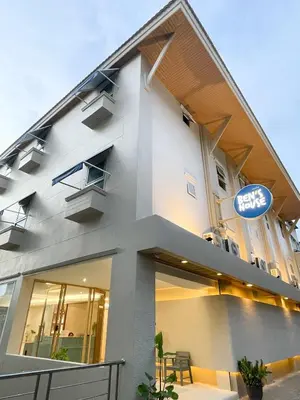 a building with a sign on the side of it at Ben's House in Ao Nang Beach