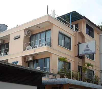 a building with a sign on top of it at J Hotel in Ao Nang Beach