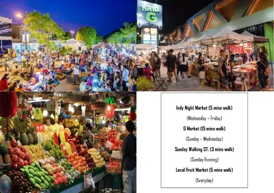 a group of people walking around a market with fruits and vegetables at The Neighbors Hostel in Phuket Town