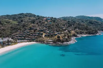 an aerial view of a beach with houses on a hill at The Shore At Katathani - Adult Only - SHA Extra Plus in Kata Beach