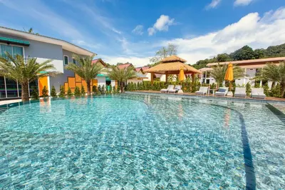 a large swimming pool in front of a building at U Rip Resort Phi Phi Hotel in Phi Phi Don