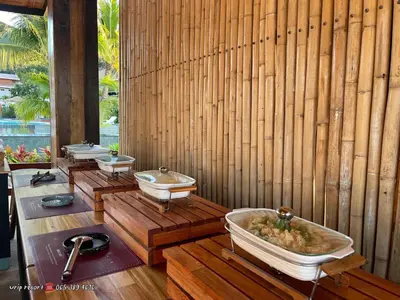 a row of sinks in a bathroom with wooden walls at U Rip Resort Phi Phi Hotel in Phi Phi Don