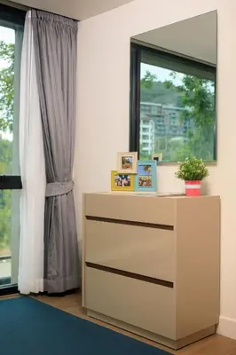 a dresser in a room with a window at The Aristo by Holy Cow, 4-BR loft, 150 m2, pool view in Surin Beach