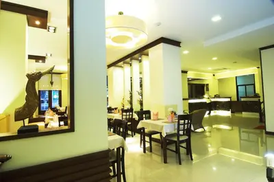 a dining room with a table and chairs at PS Hotel Phuket Patong - SHA Plus in Patong Beach