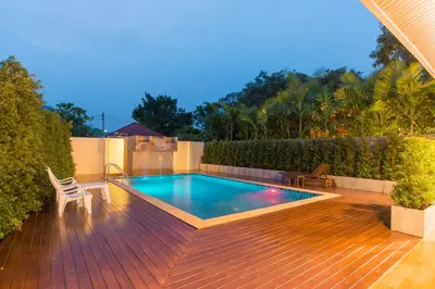 a swimming pool on top of a wooden deck at Aonang Glory Resort in Ao Nang Beach