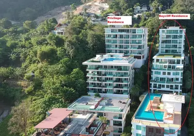 an aerial view of two tall buildings on a hill at Private sea view apartment with jacuzzi at Baycliff in Patong Beach