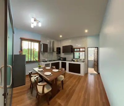 a kitchen and dining room with a table and chairs at Smile Home Krabi Klong Moung Beach in Klong Muang Beach