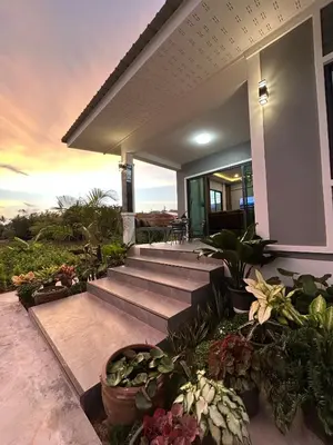 a house with a bunch of potted plants on it at Smile Home Krabi Klong Moung Beach in Klong Muang Beach