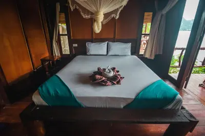 a bed in a room with a bowl on it at Phi Phi Sunset Bay Resort in Phi Phi Don
