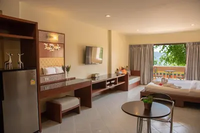 a hotel room with a bed and a desk at Park 38 Hotel - SHA Plus in Phuket Town
