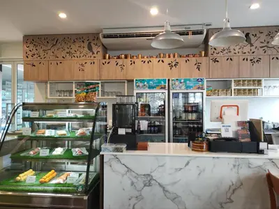 a restaurant with a counter with food on display at Park 38 Hotel - SHA Plus in Phuket Town