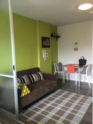 a living room with a couch and a table at D-condo mine in Kathu