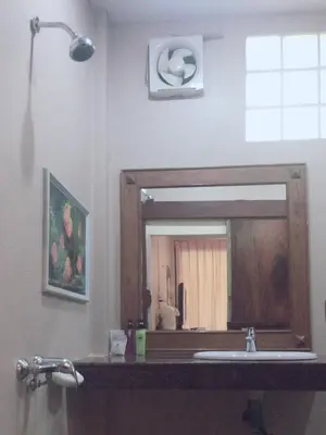 a bathroom with a sink and a mirror at JJ Bungalow in Phi Phi Don