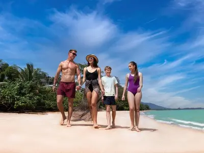 a group of people walking on the beach at Naam Sawan in Ban Pa Khlok