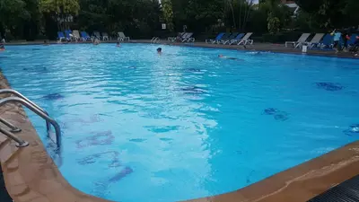 a large swimming pool with people in the water at PATONG TOWER SEA VIEW 3 BEDROOMs in Patong Beach