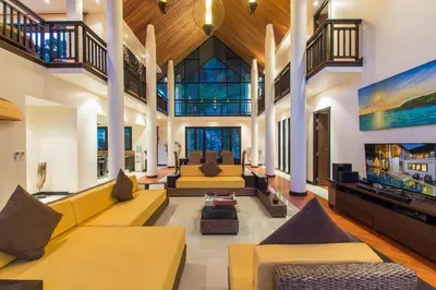 a large living room with couches and a tv at Hidden Pool Villa A Hidden Haven Just For You in Rawai Beach