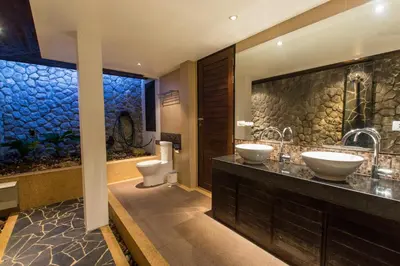 a bathroom with two sinks and two toilets at Hidden Pool Villa A Hidden Haven Just For You in Rawai Beach
