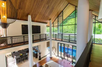 an open living room with a large window and a pool at Hidden Pool Villa A Hidden Haven Just For You in Rawai Beach
