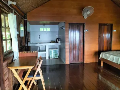 a room with a table and a kitchen in a house at Tabeak View Point in Ko Yao Noi