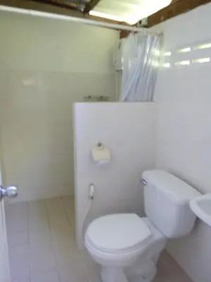 a bathroom with a white toilet and a sink at Tabeak View Point in Ko Yao Noi