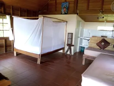 a living room with a bed and a couch at Tabeak View Point in Ko Yao Noi