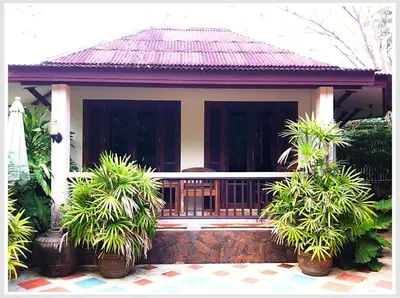 a small house with plants in front of it at The Emerald Krabi Beach Resort in Klong Muang Beach