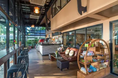 a store with a lobby with a couch and chairs at Srisuksant Resort in Ao Nang Beach