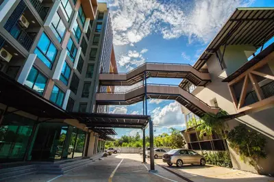 a building with a car parked in front of it at Phu Dahla Residences in Ao Nang Beach