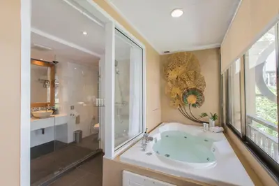 a bathroom with a sink and a shower at Burasari Phuket Resort & Spa in Patong Beach