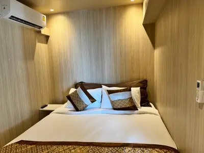 a bedroom with a large bed in a room at Condo Minium Patong Phuket in Patong Beach