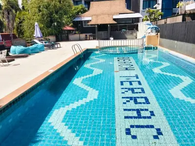 a swimming pool with a blue and white tiles on it at Days Inn by Wyndham Aonang Krabi in Ao Nang Beach