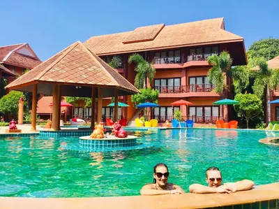 two people in the swimming pool at a resort at Andamanee Boutique Resort Aonang Krabi - Free Beach Shuttle in Ao Nang Beach