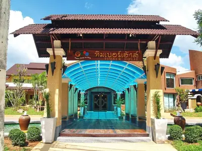 a entrance to a hotel with a blue roof at Ao Nang Timber House in Ao Nang Beach